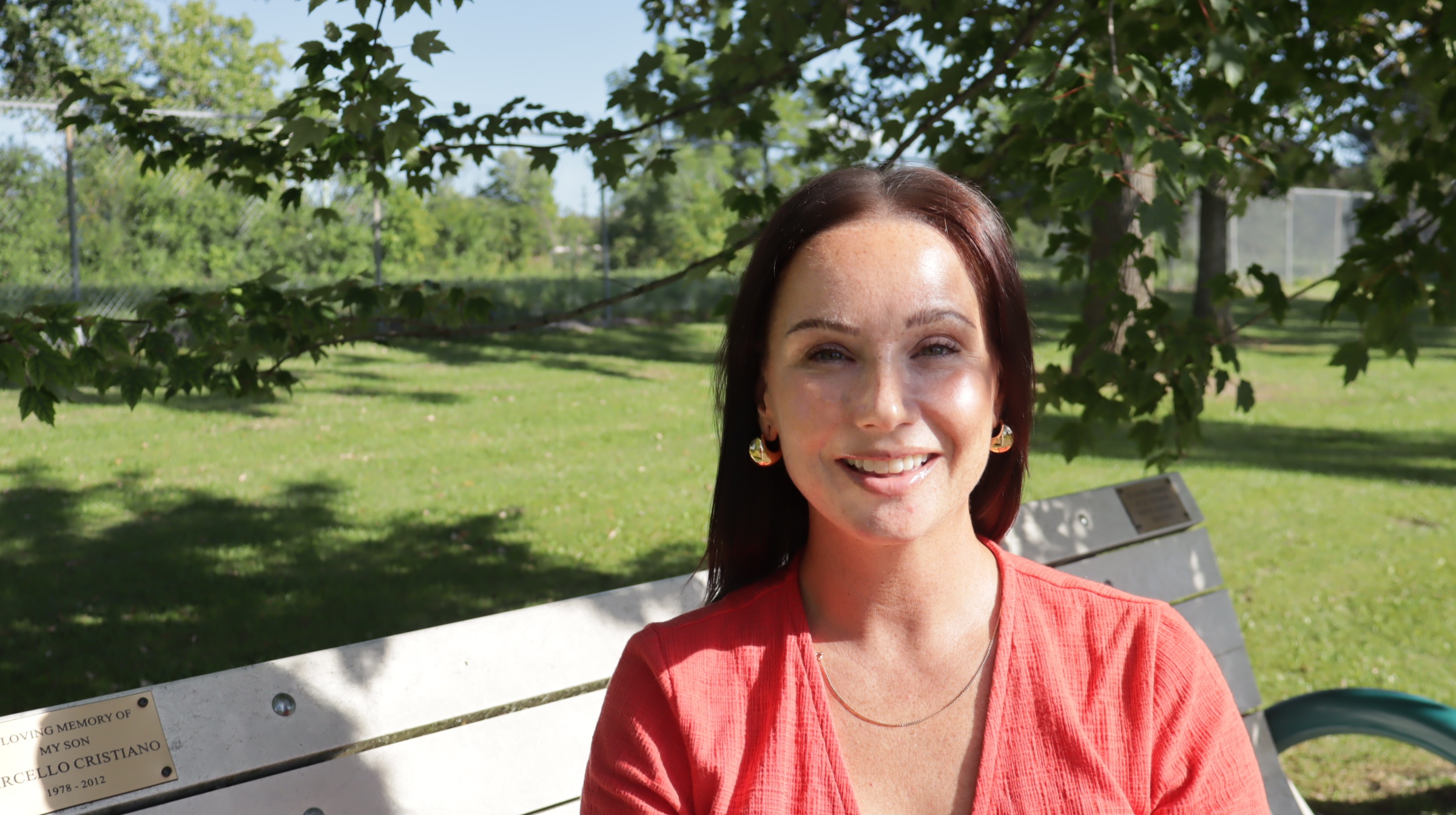 Shannon Mitchell smiling outdoors in a park setting